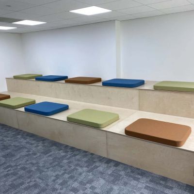 Bespoke tiered bench seating in the refurbished management suite collaboration area