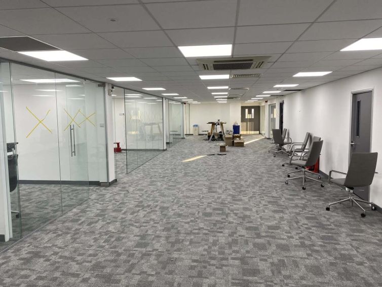 Completed commercial office fit-out with new flooring, ceiling and glazed office partitions