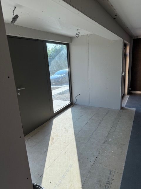 Home extension featuring large glazed gable and patio doors