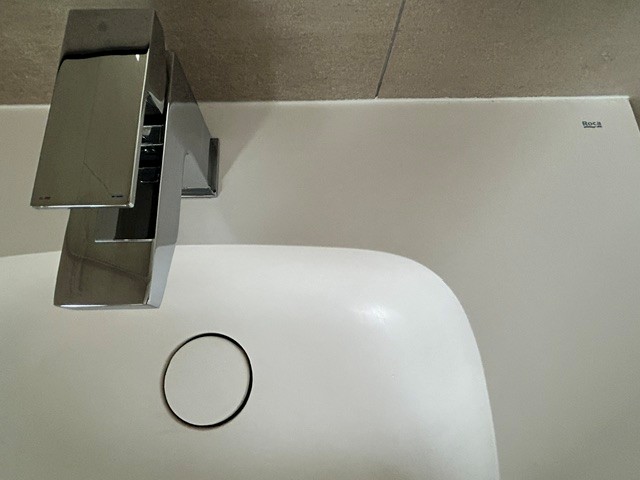 Contemporary basin and tap detail in completed wet room installation