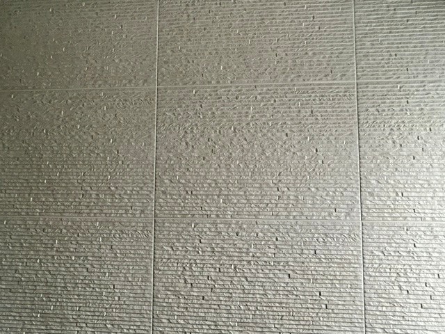 Textured wall tile finish in a residential wet room installation