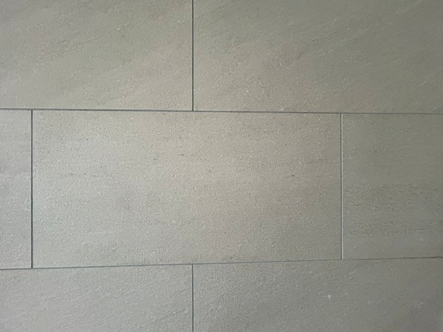 Large-format wall tiles installed as part of a residential wet room in Aberdeen